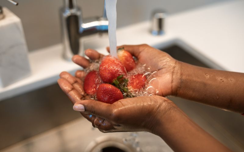 washing strawberries